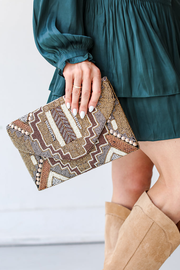 model holding a Beaded Clutch