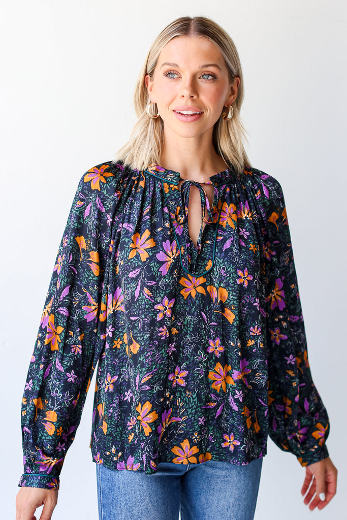 model wearing a navy Satin Floral Blouse